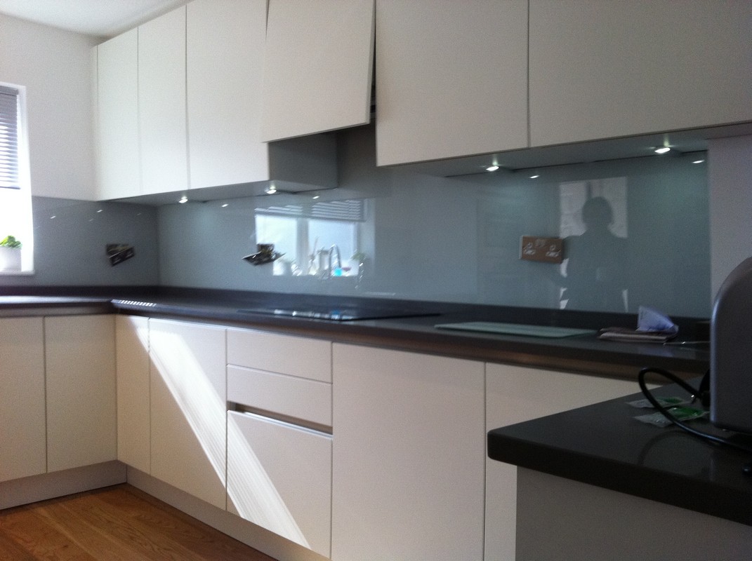 Grey glass kitchen splashback with LED lighting in Borehamwood