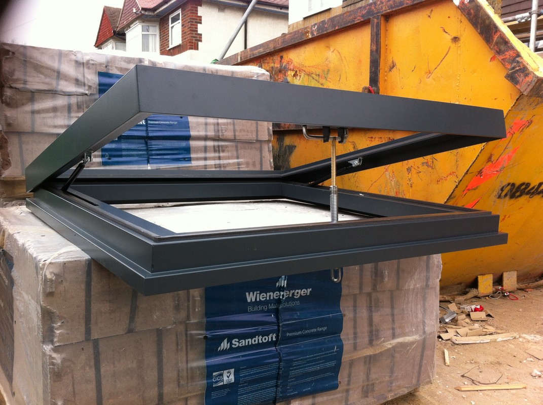Opening flat roof skylight in anthracite grey installed in Borehamwood