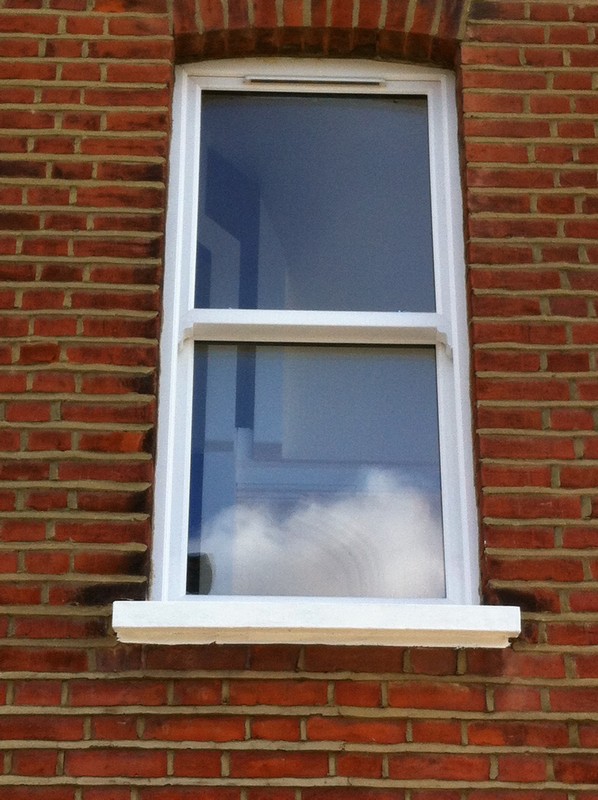 uPVC sash window on Victorian red brick house in Borehamwood